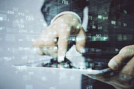 Multi exposure of mans hand holding and using a digital device and data theme drawing. Innovation...