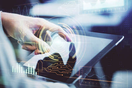 Multi exposure of mans hand holding and using a digital device and data theme drawing. Innovation concept.の写真素材