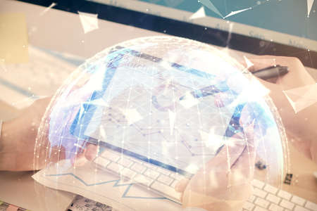 Double exposure of mans hands holding and using a phone and international business theme drawing.