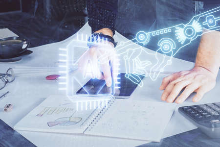 Double exposure of mans hand holding and using a digital device and data theme drawing. Technology concept.の写真素材