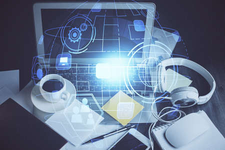 Computer on desktop with social network hologram. Double exposure. Concept of international people...