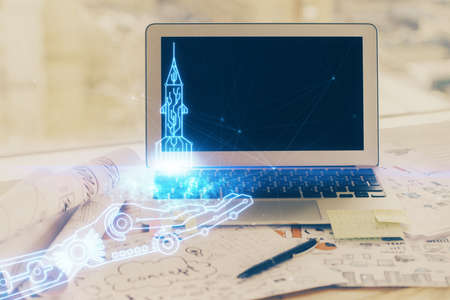 Desktop computer background in office and start up theme hologram drawing. Double exposure. Startup concept.の写真素材