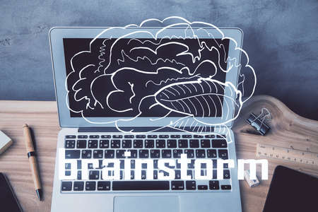 Desktop computer background in office and start up theme hologram drawing. Double exposure. Startup concept.の写真素材