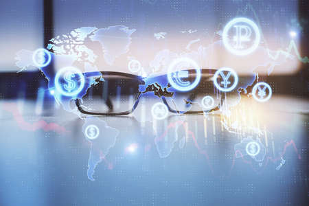 Financial graph hologram with glasses on the table background. Concept of business. Double exposure.の写真素材