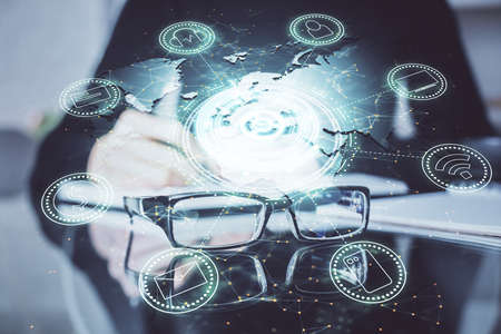 Social network theme hologram over hands taking notes background. Concept of global international...