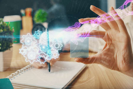 Multi exposure of writing hands on background with data solution hologram. Technology concept.