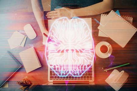 Multi exposure of writing hand on background with brain hologram. Concept of learning.