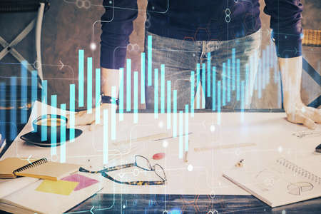 Multi exposure of man standing and planing investment with stock market forex chart background. Concept of research and trading.の写真素材