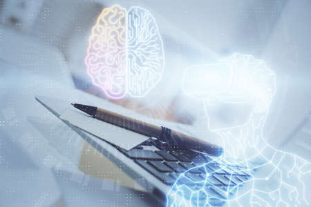 Computer on desktop with AR theme icon. Multi exposure. Concept of augmented reality.の写真素材