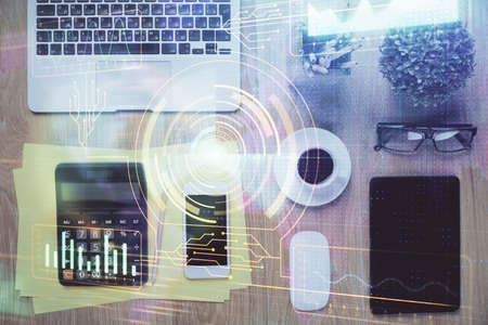 Double exposure of technology theme drawing over work table desktop. Top view. Global data analysis...