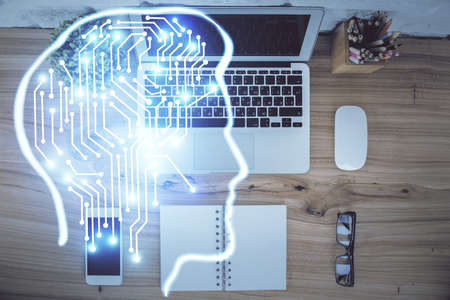 Multi exposure of brain sketch hologram over topview work table background with computer. Concept of...