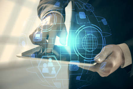 Double exposure of mans hands holding and using a phone and social network theme drawing.