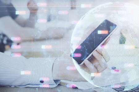 Multi exposure of mans hands holding and using a digital device and map drawing. International...
