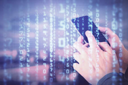 Double exposure of mans hand holding and using a digital device and data theme hologram drawing....