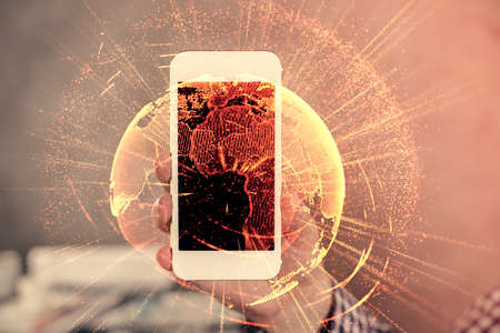 Double exposure of mans hands holding and using a phone and social network theme drawing.の写真素材