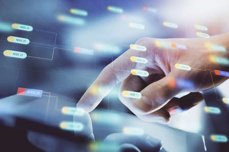 Multi exposure of mans hand holding and using a digital device and data theme drawing. Innovation...
