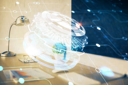 Double exposure of desktop computer and technology theme hologram. Concept of software development.