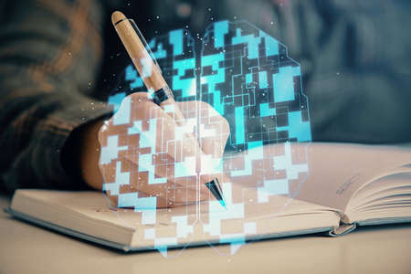 Multi exposure of womans writing hand on background with data technology hud. Concept of innovation.