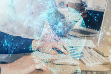 Man with computer background with brain theme hologram. Concept of brainstorm. Double exposure.