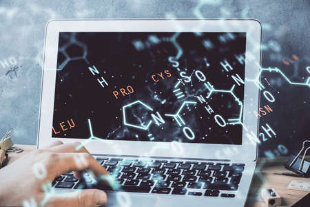 Science formula hologram with man working on computer on background. Education concept. Double...