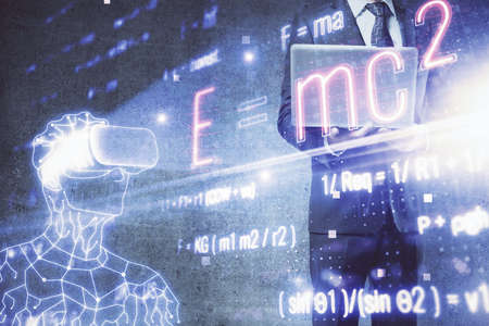 Science formula hologram with man working on computer on background. Education concept. Double exposure.の写真素材