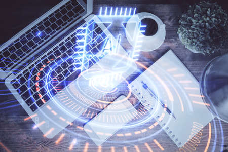Multi exposure of data theme drawing hologram over topview work desk background with computer. Concept of technology.の写真素材