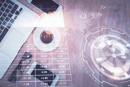 Multi exposure of financial chart hologram over desktop with phone. Top view. Mobile trade platform...