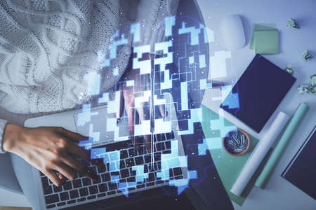 Double exposure of woman hands working on computer and data theme hologram drawing. Top View....