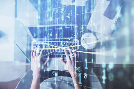 Double exposure of woman hands working on computer and data theme hologram drawing. Top View....