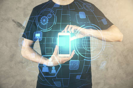 Double exposure of mans hands holding and using a phone and social network theme drawing.