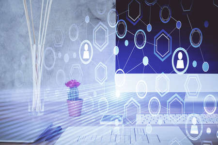 Computer on desktop with social network hologram. Double exposure. Concept of international people...