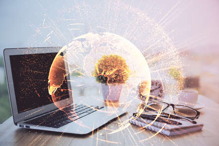 Computer on desktop with social network hologram. Double exposure. Concept of international people...