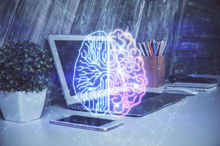 Multi exposure of work table with computer and brain hologram. Brainstorm concept.