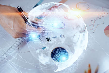 Double exposure of Man writing in notepad with business icons on background. Concept of...