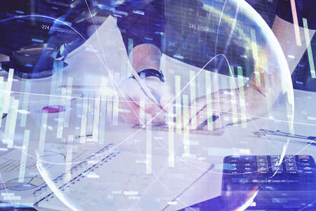 Double exposure of hands and notepad with business icons. Concept of international business.
