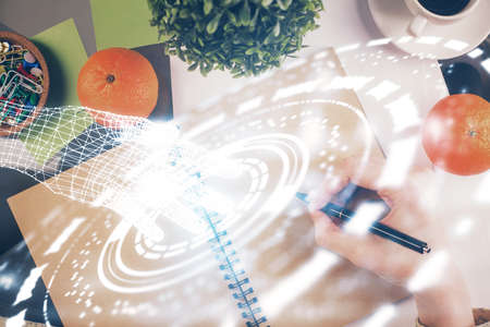 Double exposure of writing hand on background with data solution technology hologram. Ai concept.の写真素材