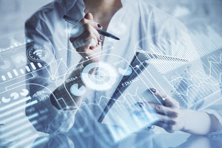 Tech theme hologram over woman's hands taking notes background. Concept of hightech. Double exposure