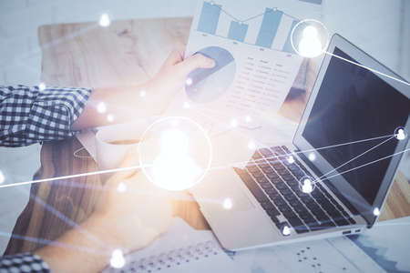 Media network theme hologram with man working on computer on background. Concept of internet...