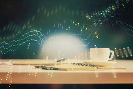 Multi exposure of forex graph drawing and desktop with coffee and items on table background. Concept...