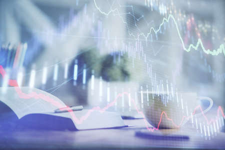 Multi exposure of forex graph drawing and desktop with coffee and items on table background. Concept...