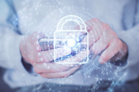 Multi exposure of man's hands holding and using a digital device and lock drawing. Security concept.
