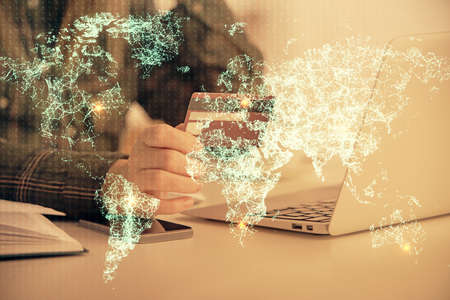 Multi exposure of woman on-line shopping holding a credit card and social network theme drawing....