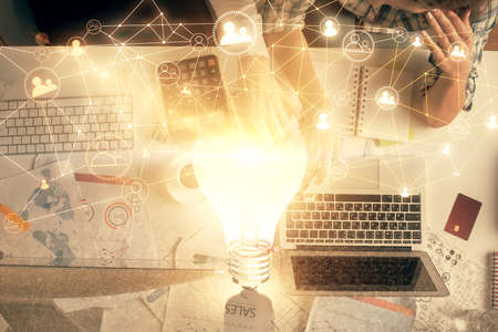 Double exposure of man and woman working together and social network theme hologram drawing....