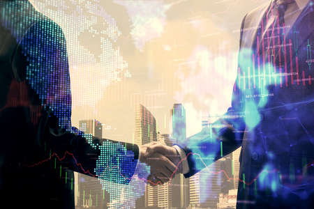 Double exposure of forex graph hologram and handshake of two men. Stock market concept.