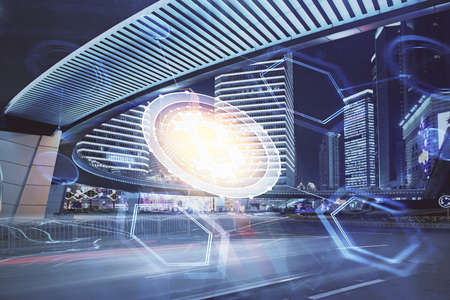 Multi exposure of cryptocurrency theme hologram drawing and city veiw background. Concept of blockchain and bitcoin.の写真素材