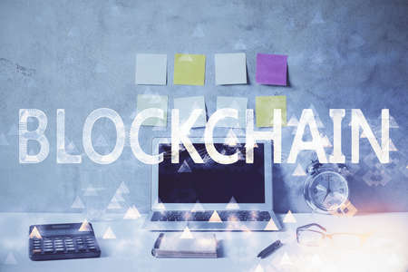 Double exposure of blockchain and crypto economy theme hologram and table with computer background. Concept of bitcoin cryptocurrency.の写真素材
