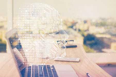 Multi exposure of work space with computer and human brain hologram. Brainstorm concept.