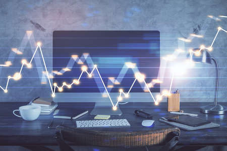 Financial chart drawing and table with computer on background. Multi exposure. Concept of...