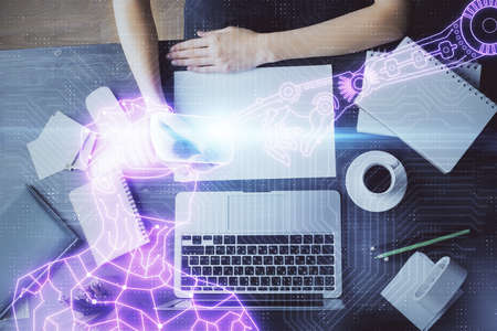 AR hologram over woman's hands taking notes background. Concept of augmented reality. Multi exposure