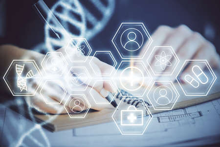 DNA theme hologram over woman's hands writing background. Concept of education. Double exposure